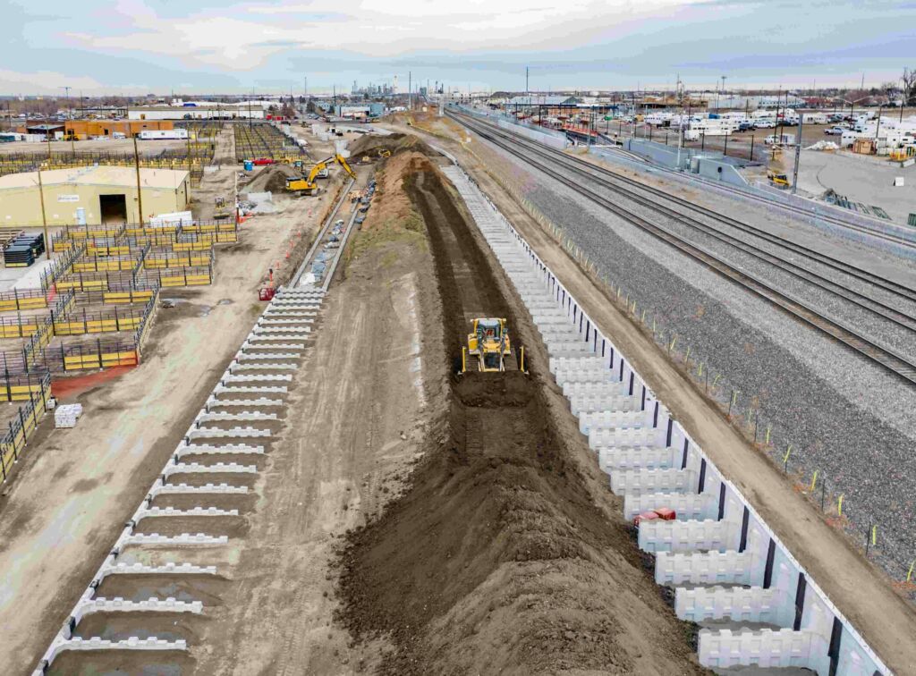 T-Wall structure under construction with backfill installation