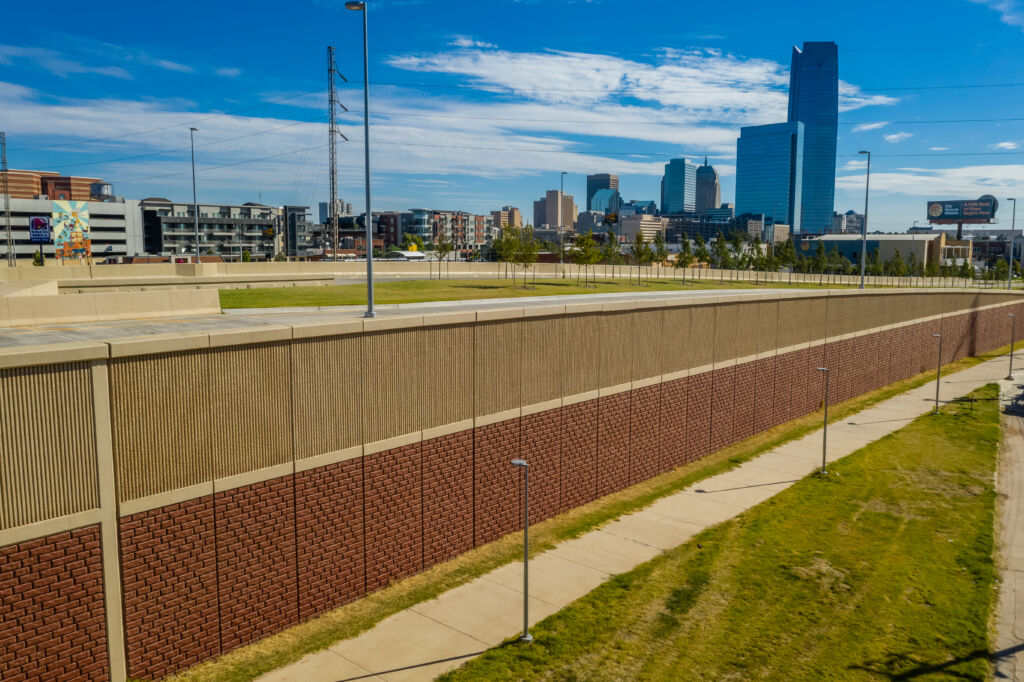 Completed TechWall structure with painted brick finish and fractured fin finish with Oklahoma City skyline in background