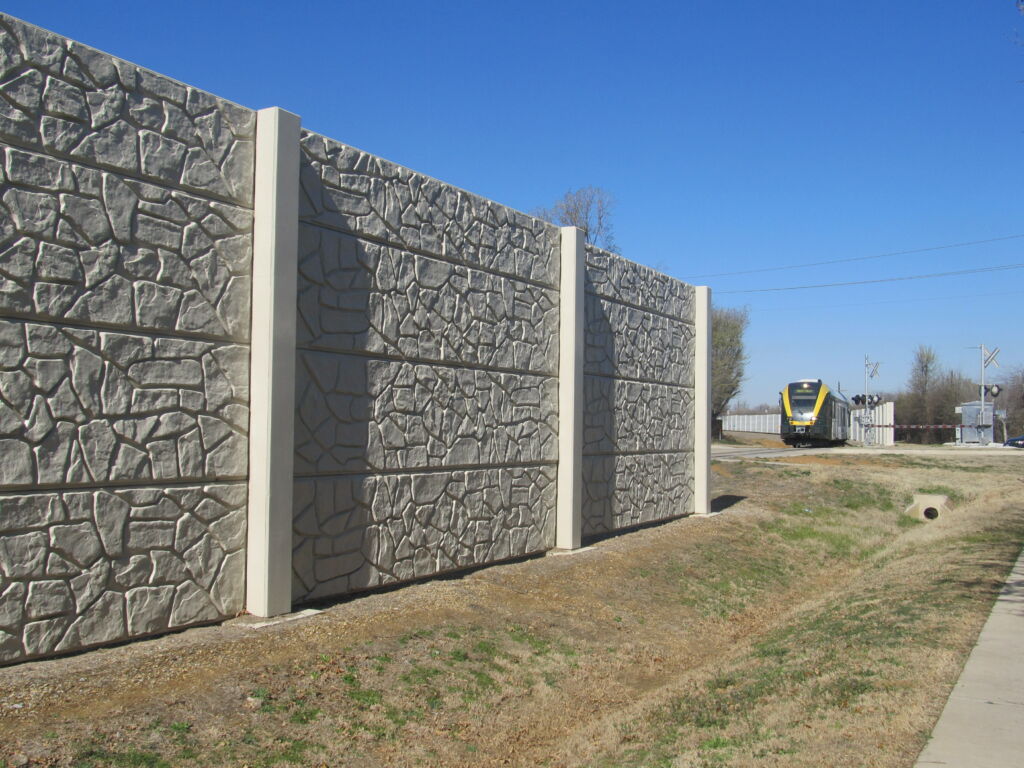 Completed post and panel wall with stone finish