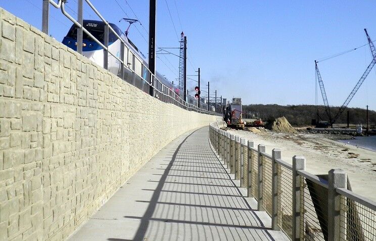 modular retaining wall supporting light rail