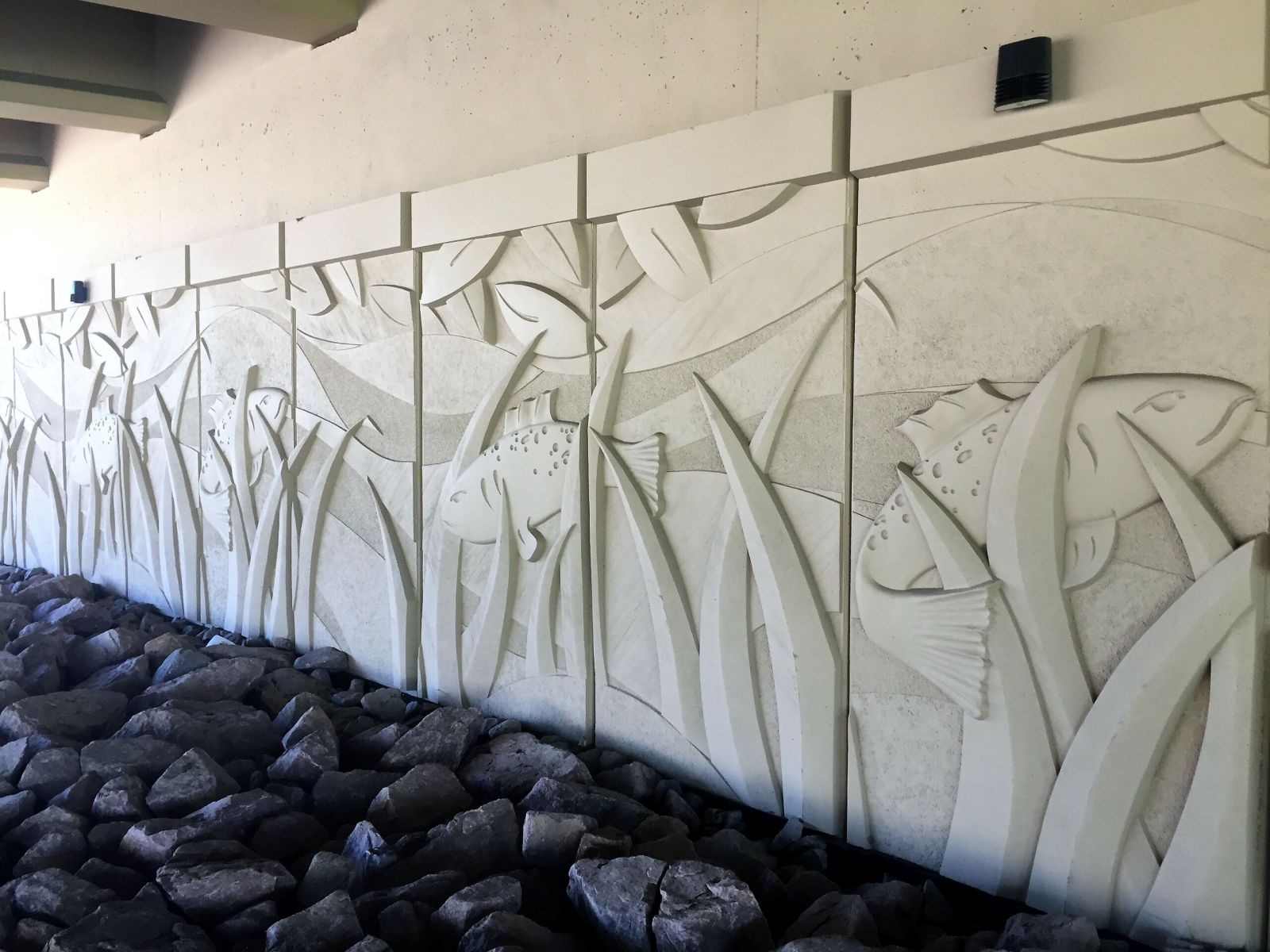 MSE wall with precast fish mural