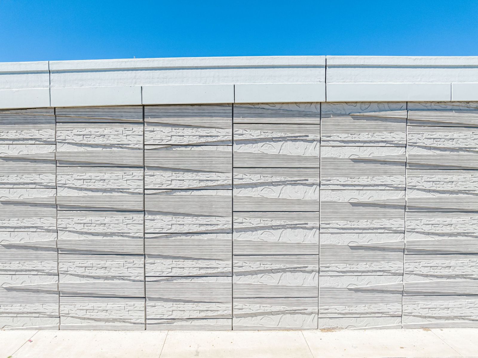 close up of MSE wall with unique panel finish