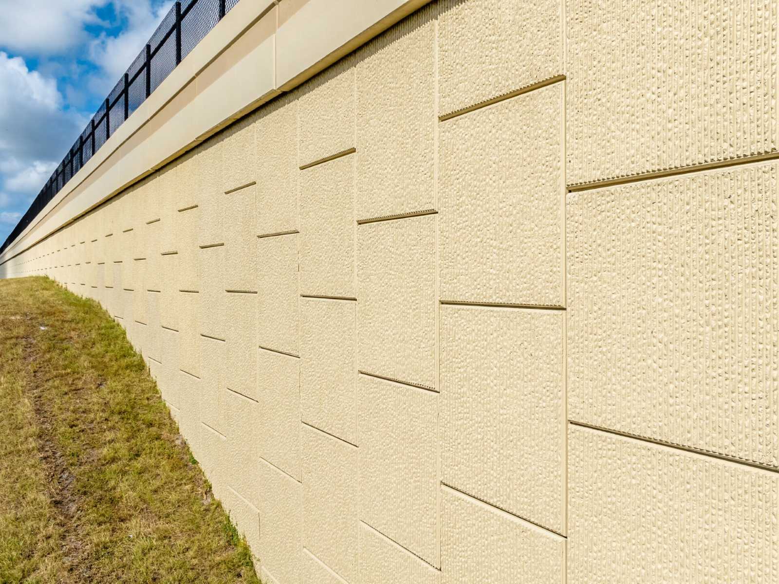painted MSE wall with fractured fin finish