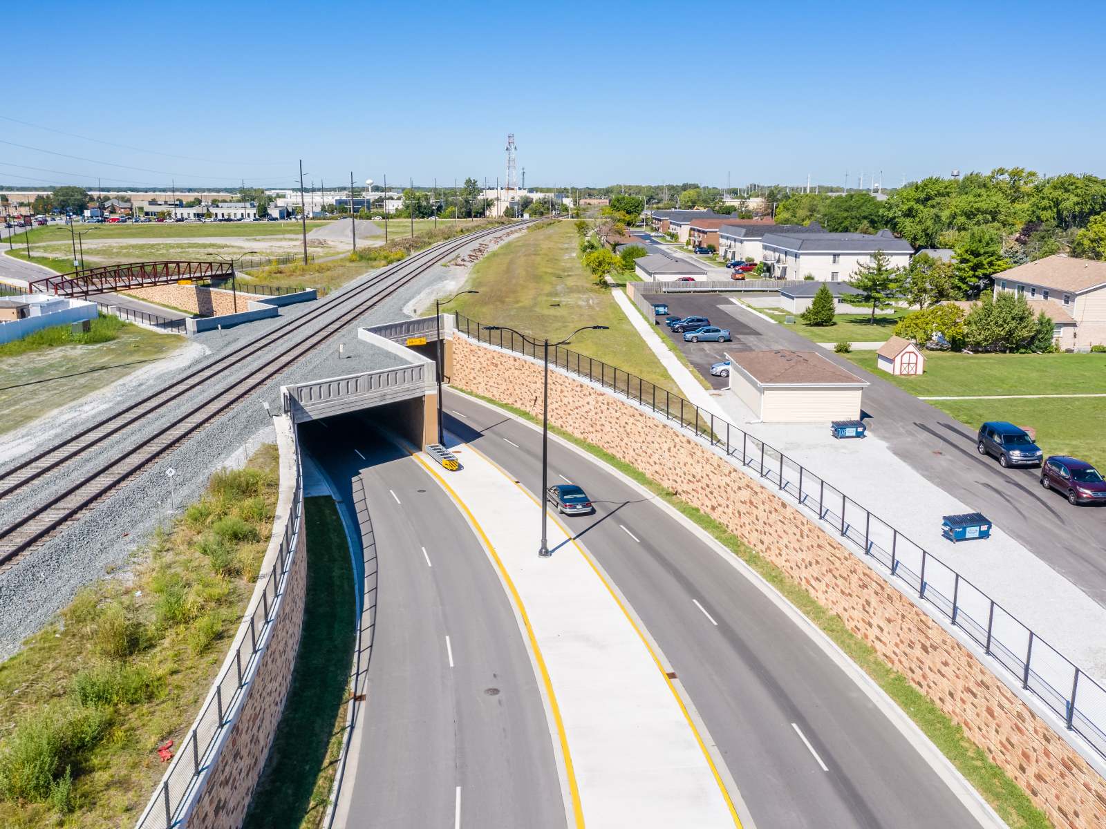 retaining walls supporting railroad overpass over roadway