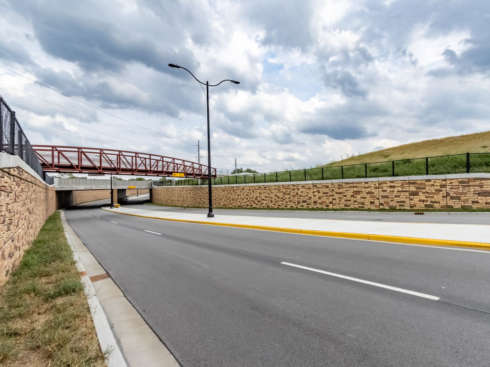 Munster-033 retaining walls supporting pedestrian bridge over roadway